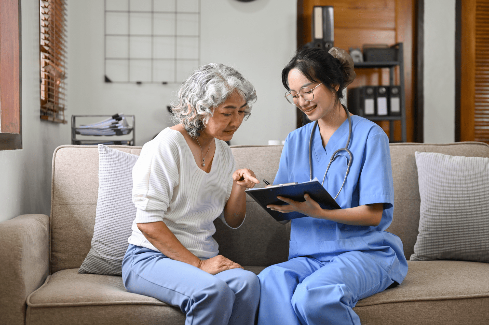 195589173_m Home healthcare nurse, physical therapy with senior adult woman at home.