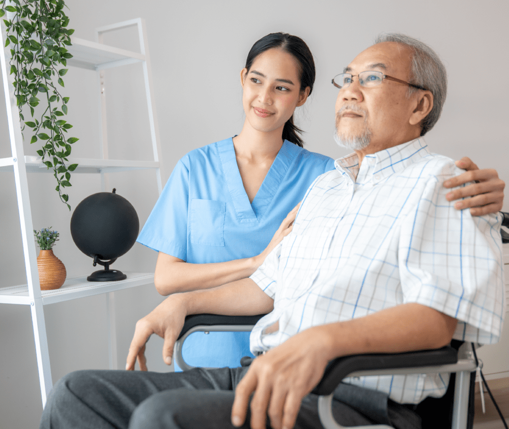 Caring nurse and a contented senior man in a wheel chair at home, nursing house. Medical for elderly patient, home care for pensioners.