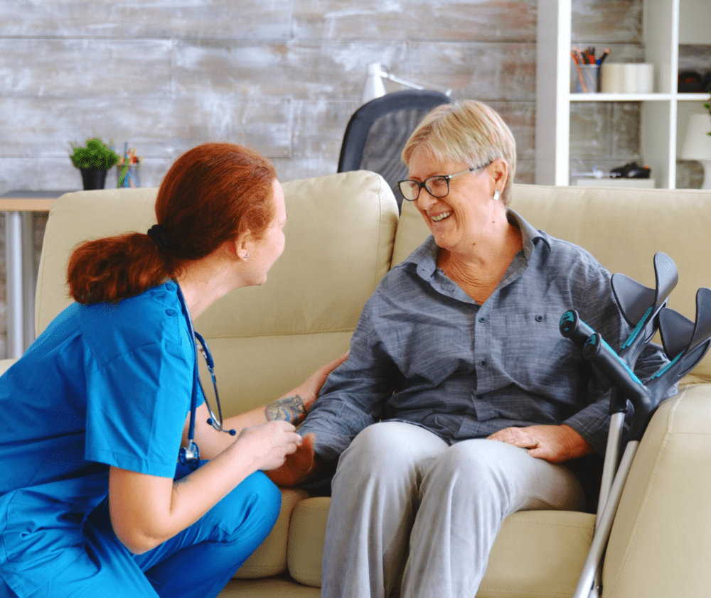 female nurse talking with old woman with alzheimer in nursing home female nurse talking with old woman with alzheimer in nursing home